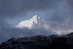 15 Chomolonzo Pokes Out From The Clouds From Camp Below Shao La Tibet.jpg